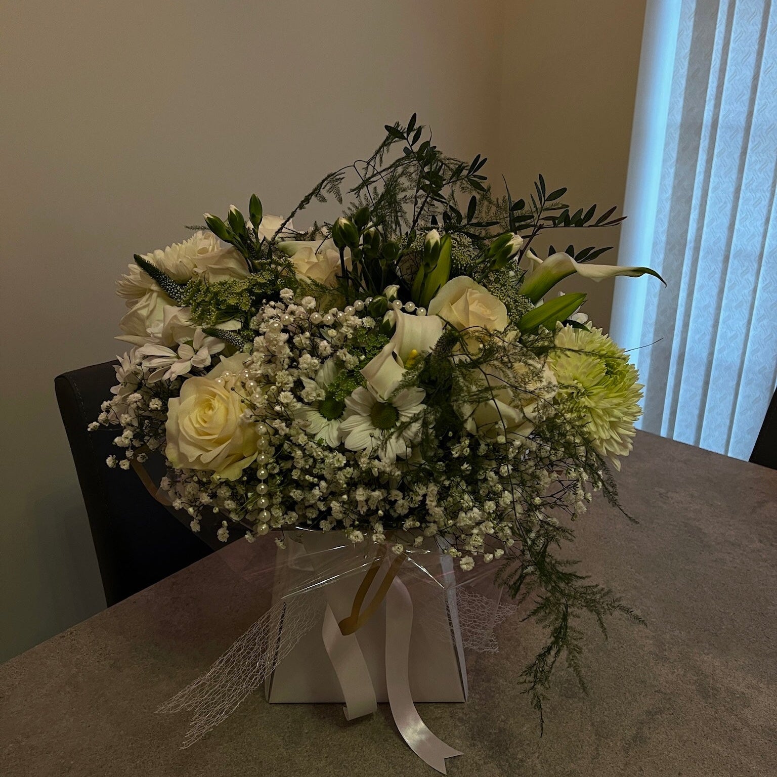 Bouquet of flowers on a table with a neutral background